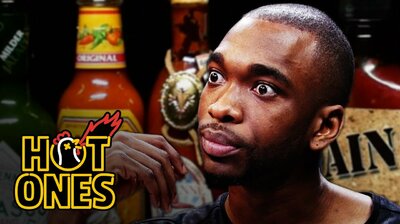 Jay Pharoah Has a Staring Contest While Eating Spicy Wings