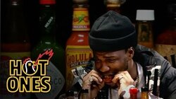 Curren$y Talks Munchies, Industry Games, and Rap Dogs While Eating Spicy Wings